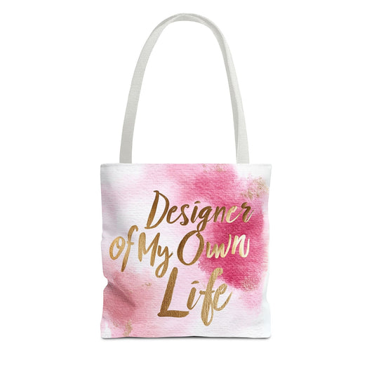 "DUO MODERN 'Designer Of My Own Life' Tote Bag in pink blush with gold font and white handle. Perfect for elegant, stylish women who take charge of their lives. Available in three sizes, blending style and functionality."