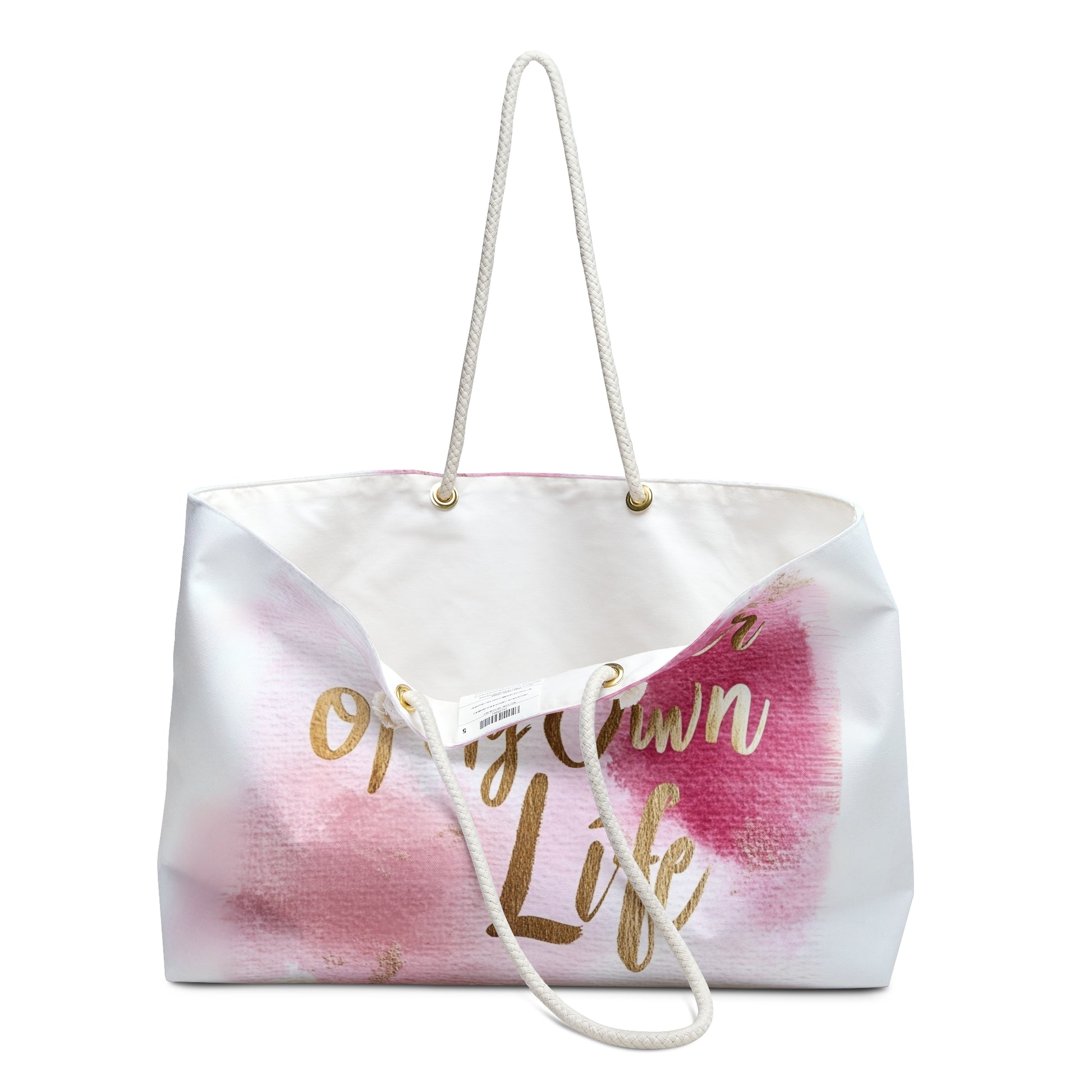 "DUO MODERN 'Designer of My Own Life' Weekender Tote in pink blush with gold font. Perfect for the modern jet-setter, combining elegance and practicality. Ideal for beach trips, luxe getaways, or city exploration."