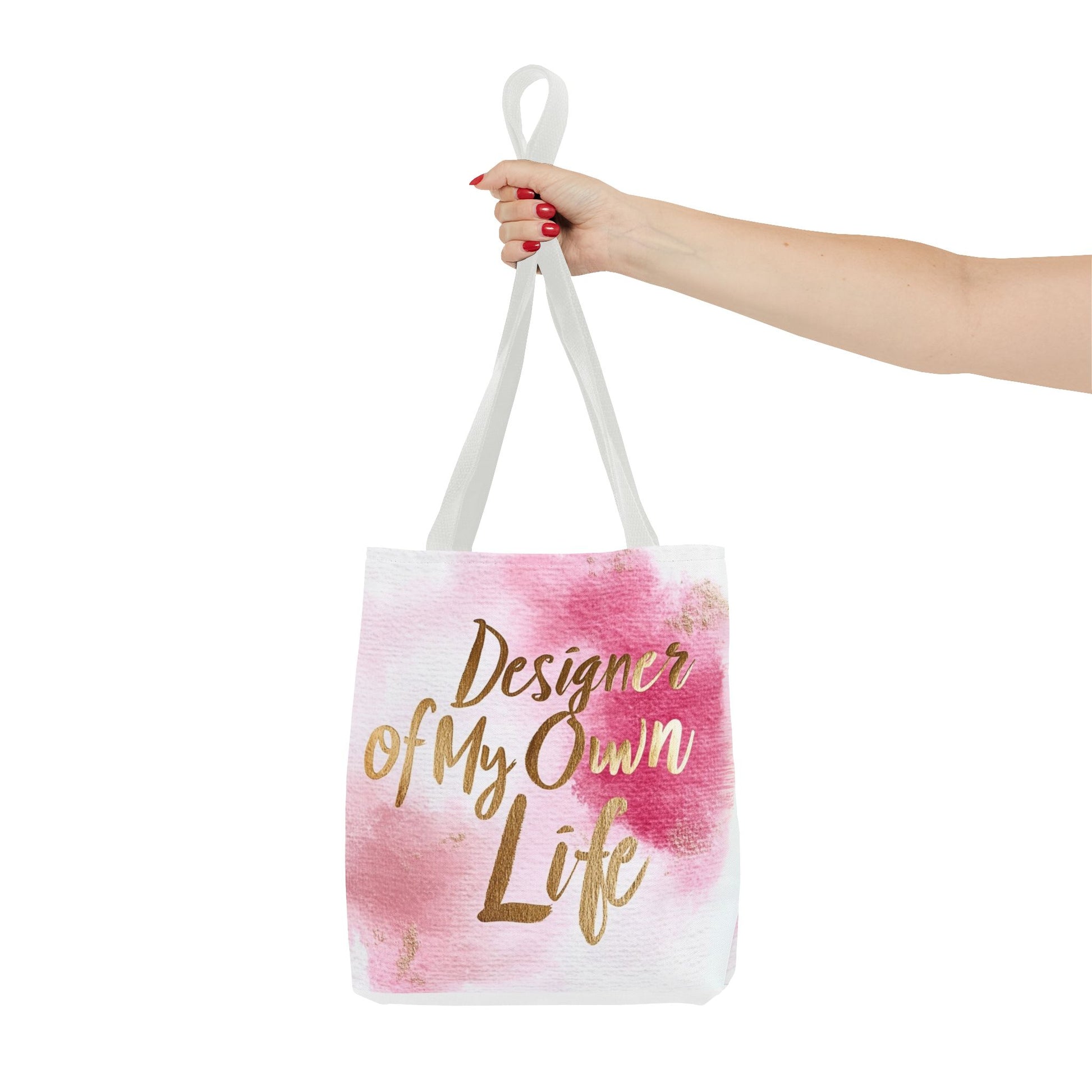 "DUO MODERN 'Designer Of My Own Life' Tote Bag in pink blush with gold font and white handle. Perfect for elegant, stylish women who take charge of their lives. Available in three sizes, blending style and functionality."