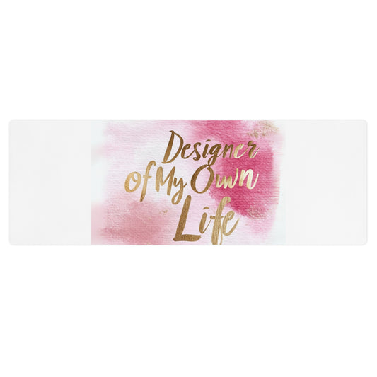 "DUO MODERN 'Designer of My Own Life' Yoga Mat in pink blush with gold font. Perfect for exercise, meditation, or stretching. Offers stability, comfort, and portability. Enhances your practice with style and functionality."