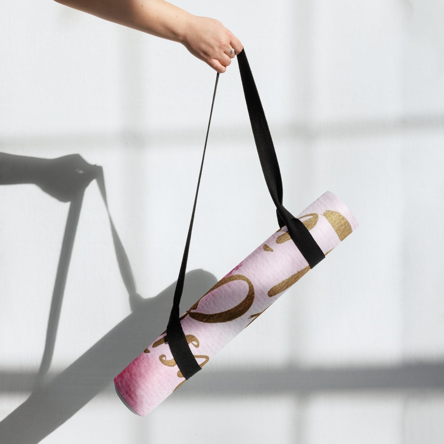 "DUO MODERN 'Designer of My Own Life' Yoga Mat in pink blush with gold font. Perfect for exercise, meditation, or stretching. Offers stability, comfort, and portability. Enhances your practice with style and functionality."
