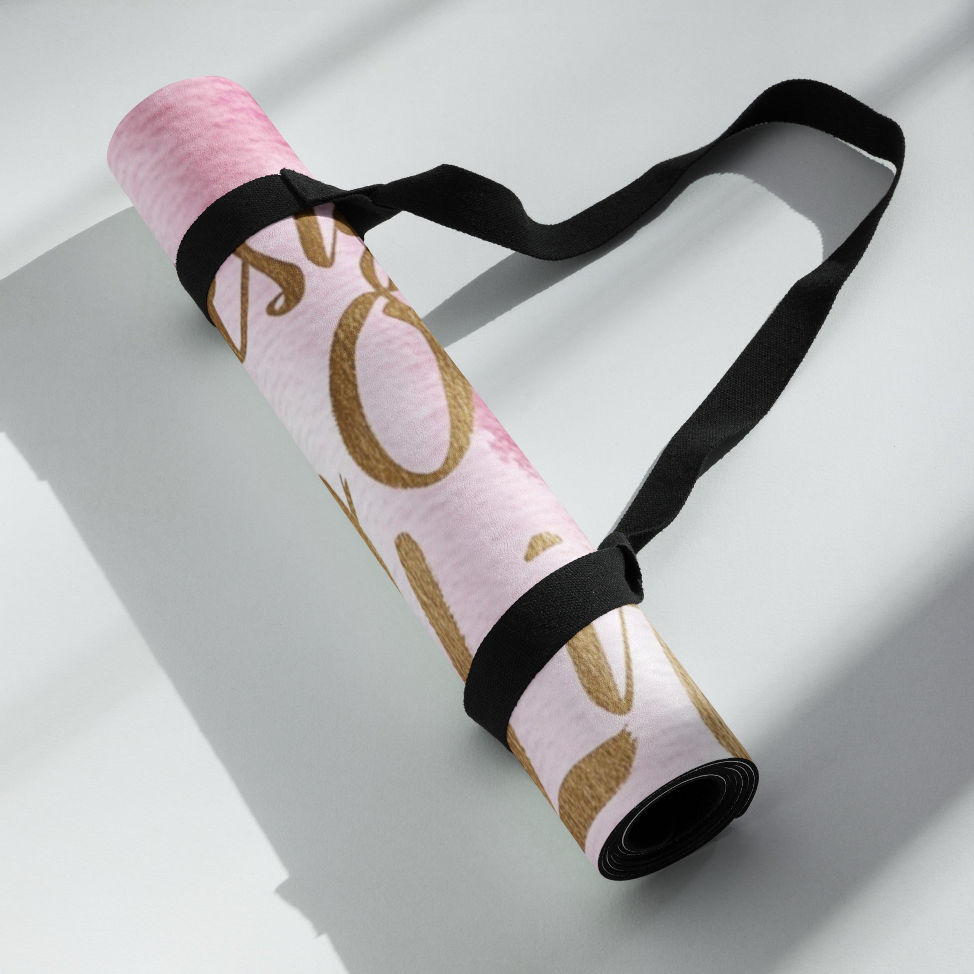 "DUO MODERN 'Designer of My Own Life' Yoga Mat in pink blush with gold font. Perfect for exercise, meditation, or stretching. Offers stability, comfort, and portability. Enhances your practice with style and functionality."